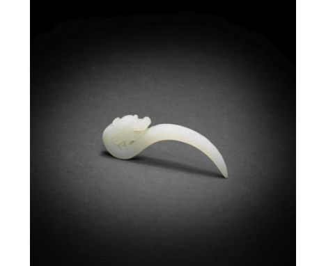 A RARE VERY PALE GREEN JADE 'DRAGON' KNOT-LOOSENER, XI18th/19th centuryOf elegantly curving C-form, the fang-shaped tool term