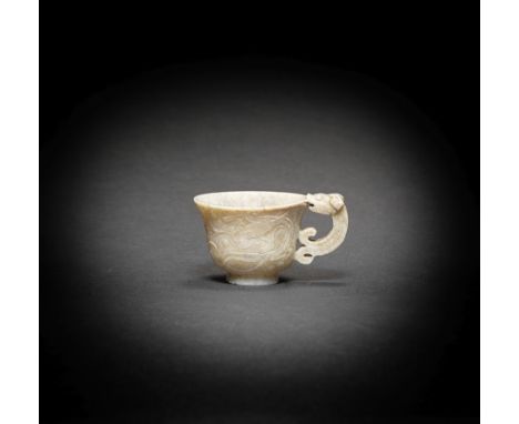 A 'CHICKEN BONE' JADE HANDLED CUPMing DynastyExpertly hollowed with deep sides rising from a short tapering foot to an everte