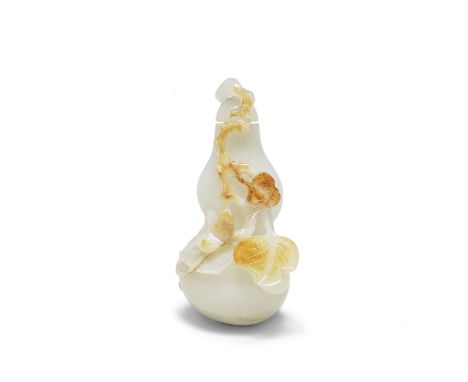 A WHITE AND RUSSET JADE 'DOUBLE-GOURD' SNUFF BOTTLE AND STOPPER18th centuryNaturalistically carved and hollowed as a ripe dou