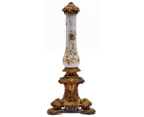 A Victorian gilt lacquered brass and&nbsp;enamelled opaline glass oil lamp, c1860, decorated with flowers and gilt C-scrolls,