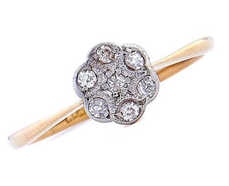 A diamond cluster ring, millegrain set in gold, marked 18ct, 2g, size K½ 