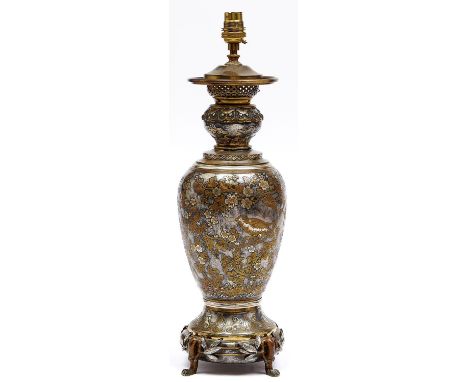 A French Japonisme etched and silvered brass oil lamp, c1885, on four bamboo shaped feet, adapted for electricity, 40cm h exc