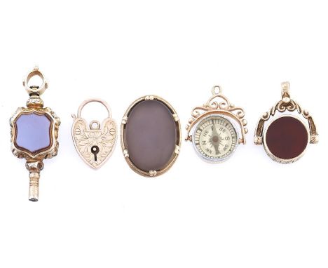 A Victorian chased gold watch key, set to either side with shield shaped agate or citrine, 40mm, mid 19th c, two gold watch f
