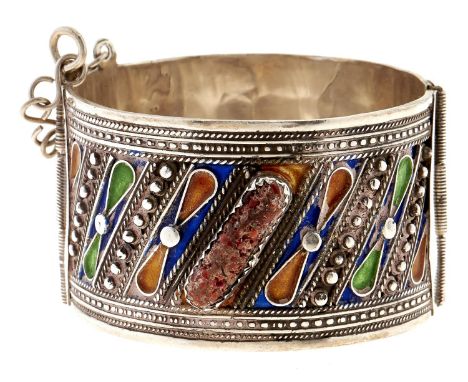 A Middle Eastern coral and silver and enamel bangle 