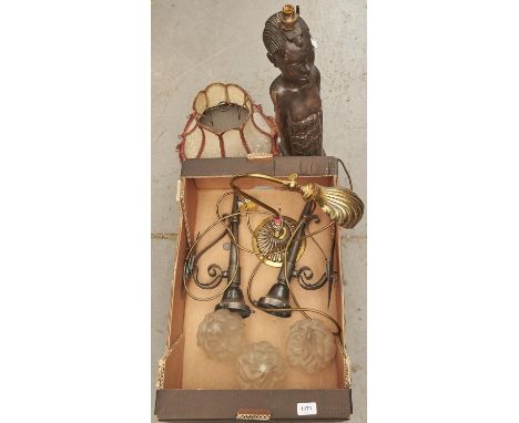 An African carved hardwood figure of a kneeling female, her arms beside her, shaped oval base, 54cm h, later mounted for an e