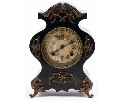 A brass mounted black painted cast iron mantel clock in rococo style, c1900, waisted case applied rosettes and ribbon tied sc