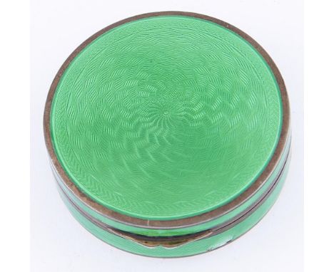 A Continental silver gilt and green guilloche enamel compact, 52mm diam, import marked London 1927 
