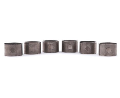 A set of six George V silver napkin rings, engine turned, by A Buckley Limited, Birmingham 1922, cased, 4ozs 