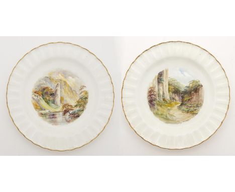 A pair of Royal Crown Derby fluted plates, 1930's, painted by W E J Dean, one signed, with a Derbyshire landscape, 22.5 diam,