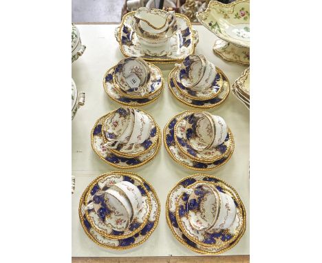 A Coalport blue Batwing pattern tea service for twelve, c1925, the service including a pair of square plates with pierced han