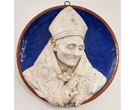 An Italian glazed terracotta portrait roundel of a bishop, in della Robbia style, late 19th c, 31cm diam 