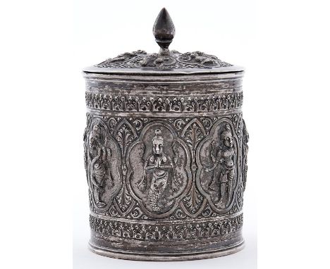 An Indian silver repousse cylindrical tea caddy and cover, Madras, c1890, worked with a swami band with gods, 11cm h, 7ozs 8d