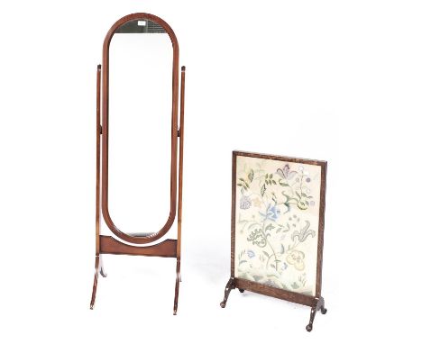A mahogany cheval mirror, 20th c, 50cm h and an oak firescreen with embroidered banner 