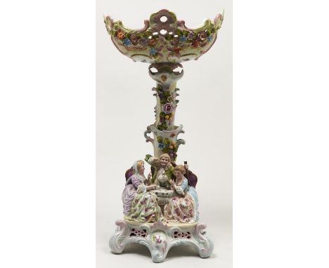 A German floral encrusted 'tea party' centrepiece, c1900, the richly decorated pierced bowl on conforming trunk, the baes wit