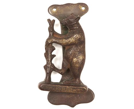 A brass door knocker in the form of the Dudley family bear and ragged staff emblem, inscribed PENSHURST [PLACE], early 20th c