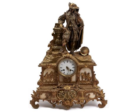 A French gilt spelter mantel clock, c1870, the ornate case with figure beside a pillar, a helmet at his feet, the white ename