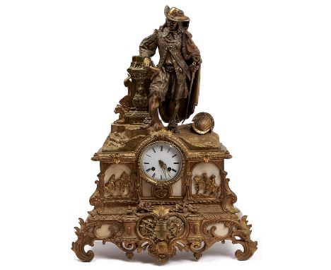 A French gilt spelter mantel clock, c1870, the ornate case with figure beside a pillar, a helmet at his feet, the white ename