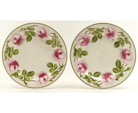A pair of Wedgwood Queen's ware plates, early 20th c, painted by R Tatler, both signed, with cabbage roses, green rim, 21cm d
