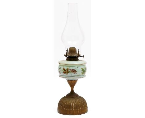 A Victorian brass oil lamp, late 19th c, the reeded hemispherical foot beneath enamelled glass fount, 30cm h excluding chimne