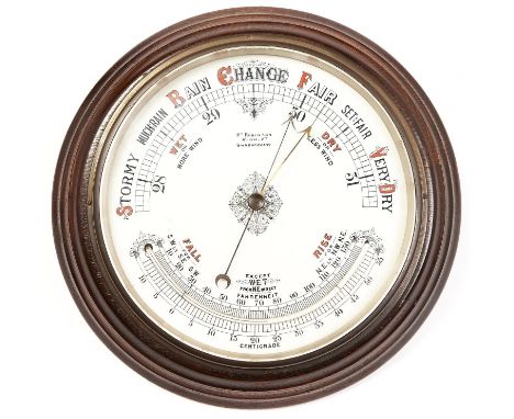 An oak framed aneroid barometer with thermometer, the cream pottery dial inscribed Henry Robinson, High Street Shrewsbury, th