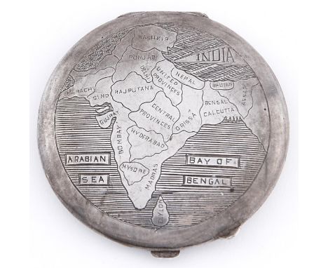 A silver compact, c1930, the lid engraved with a map of India divided into its provinces, 72mm 