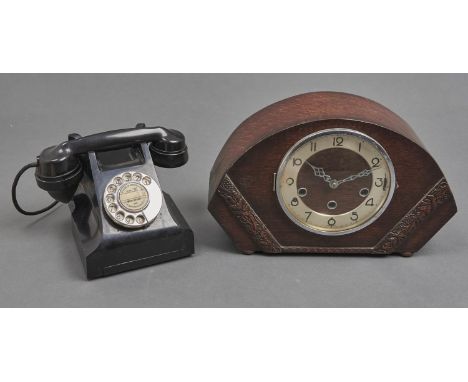 A T E L black Bakelite&nbsp;table telephone,&nbsp; the underside marked JL 11560 A6 and an oak mantel clock with chiming move