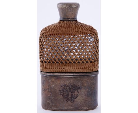 A Victorian silver mounted glass hip flask, with wicker covered shoulder, detachable cup, 11.5cm, London 1874 