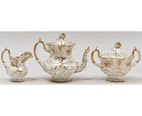 A Rockingham gilt teapot and cover, sucrier and cover and cream jug, c1838-42, of single spur handle shape, teapot and cover 