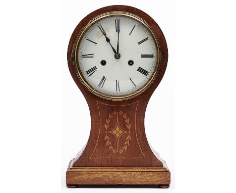 An inlaid mahogany balloon shaped mantel clock, first half 20th c, the cream enamel dial with roman numerals, twin winding ho