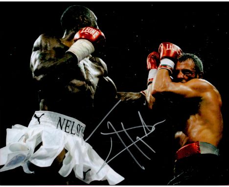 Johnny Nelson signed 10x8 colour photo pictured during one of his World Title fights. Ivanson Ranny "Johnny" Nelson[1] (born 