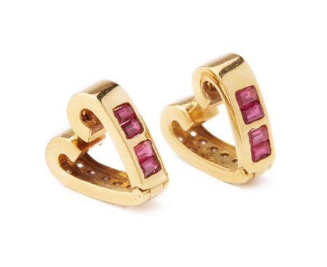 A PAIR OF RUBY AND DIAMOND REVERSIBLE EARRINGS Set to one side with a channel of rubies and the other side with two rows of d