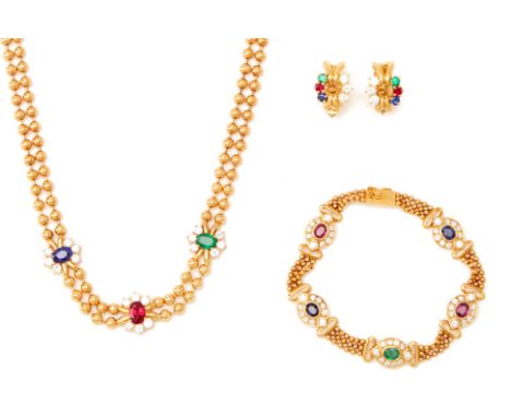 A SUITE OF DIAMOND, RUBY, SAPPHIRE &amp; EMERALD JEWELLERY
Comprising a necklace, a bracelet and a pair of earrings, in 18k g