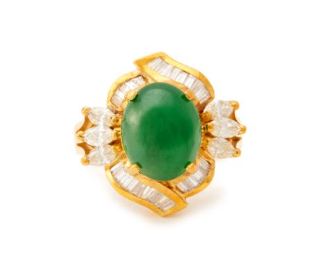 A DIAMOND AND CABOCHON JADE RING
The oval green jade cabochon within a surround of marquise and tapering baguette cut diamond