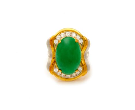 A LARGE JADE AND DIAMOND RING
To be sold with no reserve, from an estate collection of jewellery
The oval jade cabochon in a 