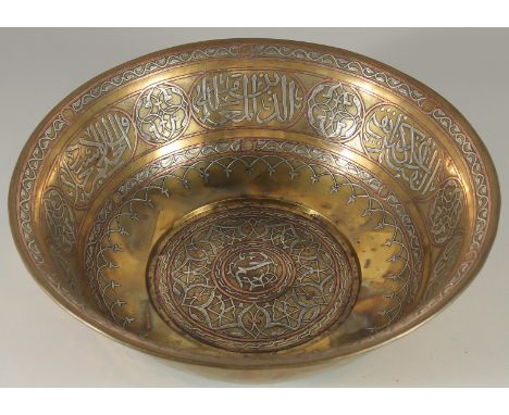 A FINE LARGE 19TH CENTURY CAIROWARE SILVER AND COPPER INLAID BRASS BOWL/ WASHING BASIN, the interior with panels of calligrap