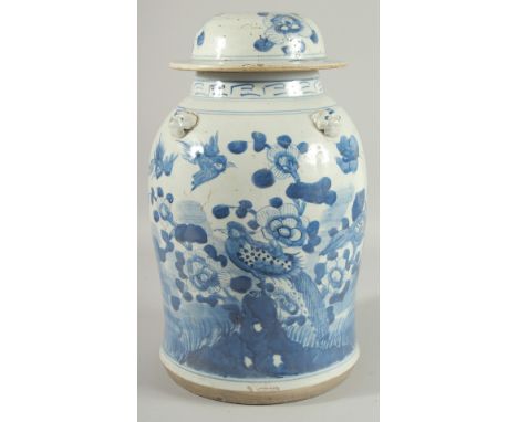 A LARGE CHINESE BLUE AND WHITE PORCELAIN LAMP STAND JAR AND COVER, painted with birds and native flora, the shoulder with mou