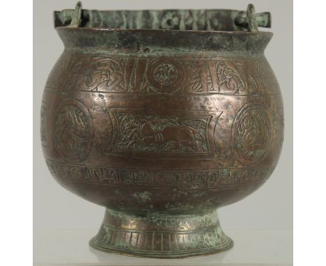 A FINE 13TH CENTURY PERSIAN SELJUK KHURASAN BRONZE BUCKET, with engraved animal motifs, 12cm high (excluding handle).
