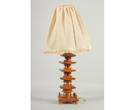 A CHINESE CARVED BOXWOOD PAGODA FORM LAMP, with shade, 51cm high overall.