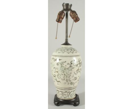 A CHINESE PORCELAIN VASE LAMP, mounted to a hardwood base, decorated with grapes, 55cm high overall.