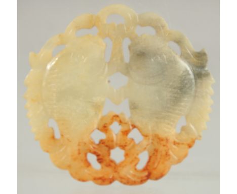 A CHINESE JADE AMULET, pierced and carved with mirrored fish, 5.5cm x 6cm.