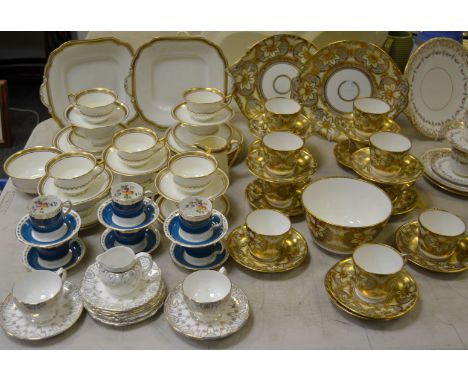 Teawares - a heavily gilded tea service comprising 11 teacups & saucers, two cake plates and bowl; an Aynsley tea service wit