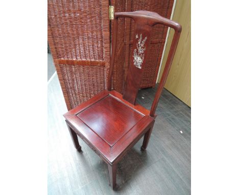 A late 20th century hardwood Eastern dining table and chairs having mother of pearl inlay decoration comprising circular tabl