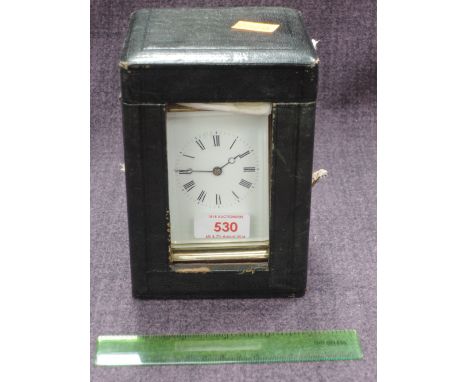 A brass frame carriage clock of traditional four glass design in leather caseCONDITION REPORTKey presentWinds up but not runn