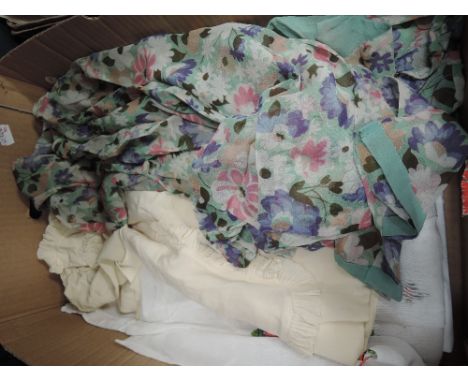 A selection of vintage textiles including lace edged pillow cases, tray cloth, silk and cotton lawn tops, skirts and dresses 