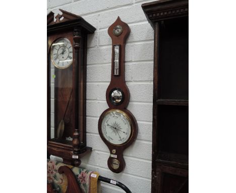 A 19th century mahogany wheel barometer having humidity and thermometer scales 