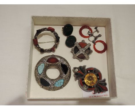 A small selection of costume jewellery including Celtic style multi stone brooches, carved agate style ring drop earrings etc