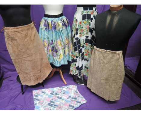 Five assorted lady's vintage skirts including printed floral full skirt with layered underskirt, patch work skirt by Brooks b