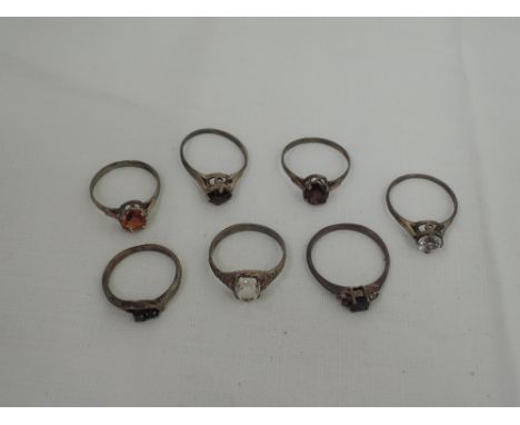 Five lady's HM silver dress rings having facetted stone solitaires including garnet, rock crystal and citrine, and two simila