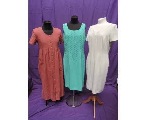 Three vintage lady's day dresses including pink button through dress by Orvis,  spearmint green dress by Frank Usher and a ja