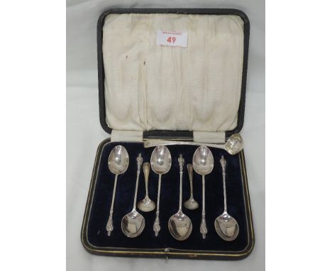 A cased set of six silver Apostle tea spoons Sheffield 1919, James Deakin & Sons, a Georgian silver miniature ladle, London 1